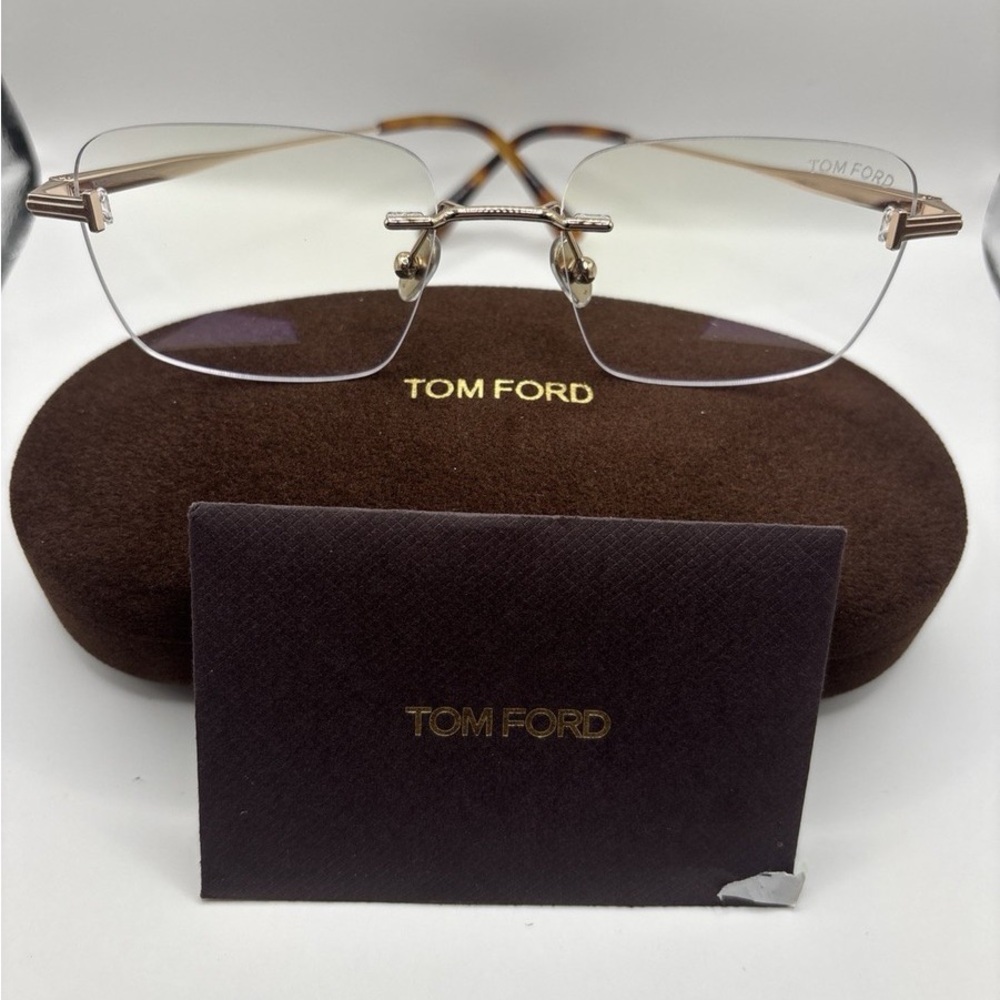 Tom Ford Gold Rimless Eyeglasses with transition brown Lenses